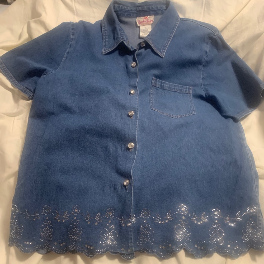 Short sleeved blue denim shirt with embellishment at bottom